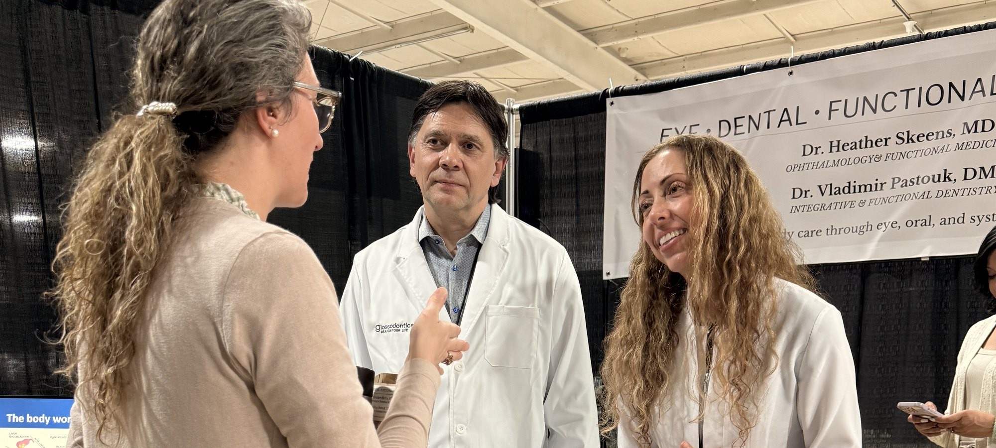 Both doctors presenting the mouth-eye connection to clinicians in Dallas