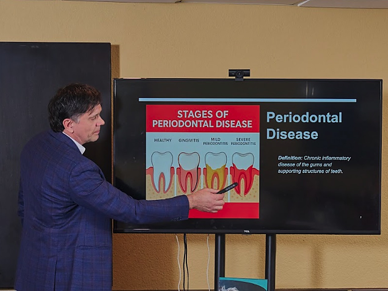 A doctor explaining a case with imaging