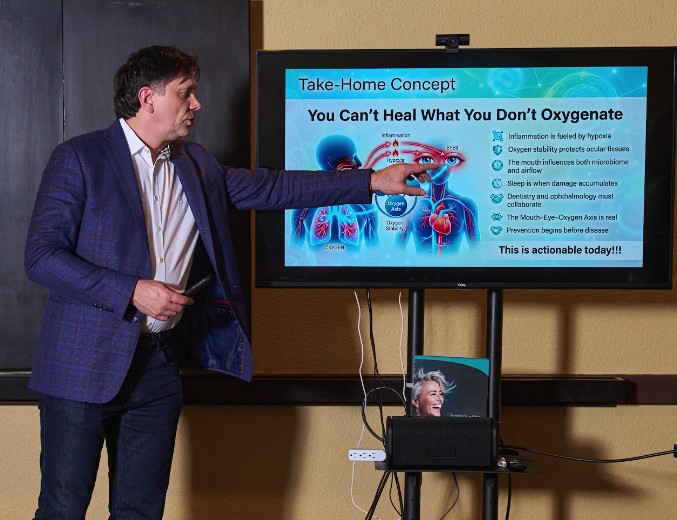 Dr. Pastouk presenting the mouth-eye-oxygen concept to clinicians at a conference